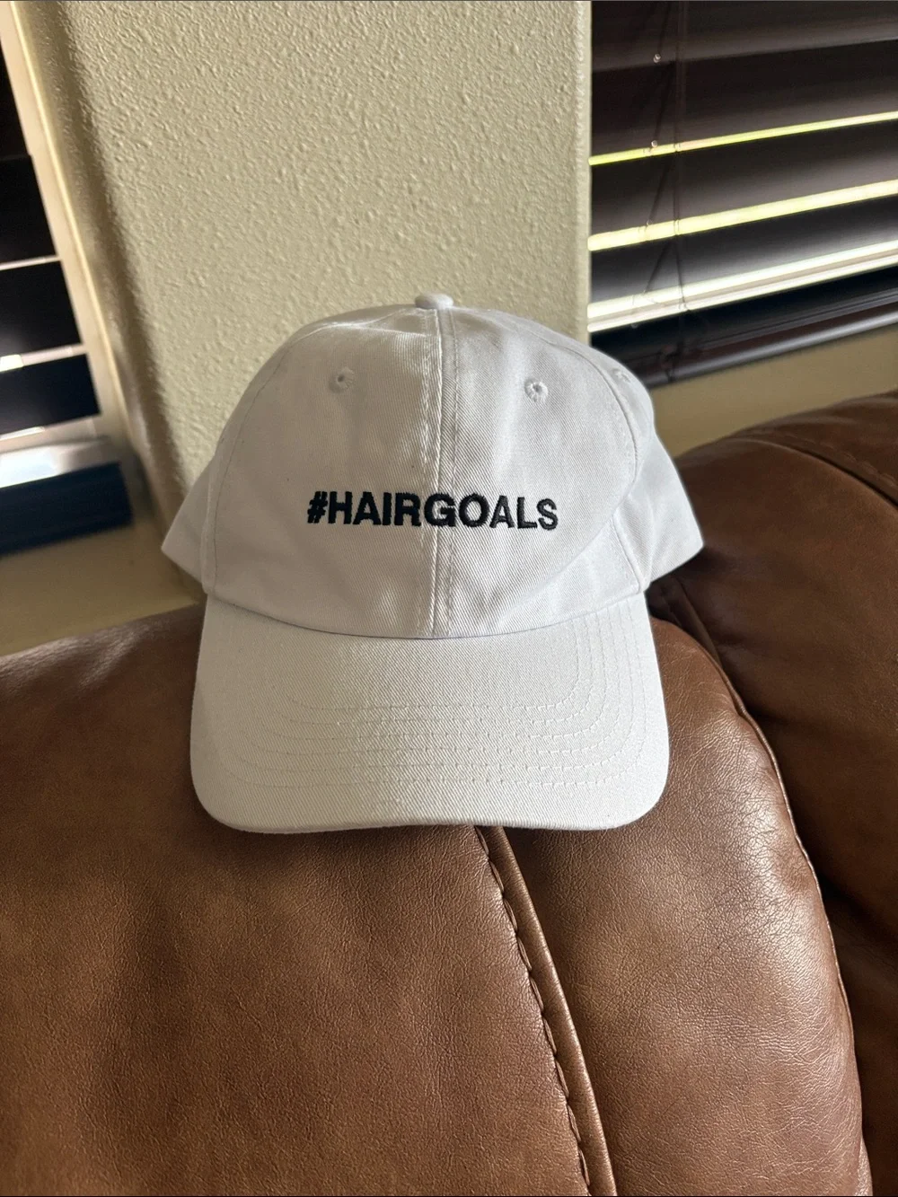 Kids White Baseball Cap with #HAIRGOALS Embroidery